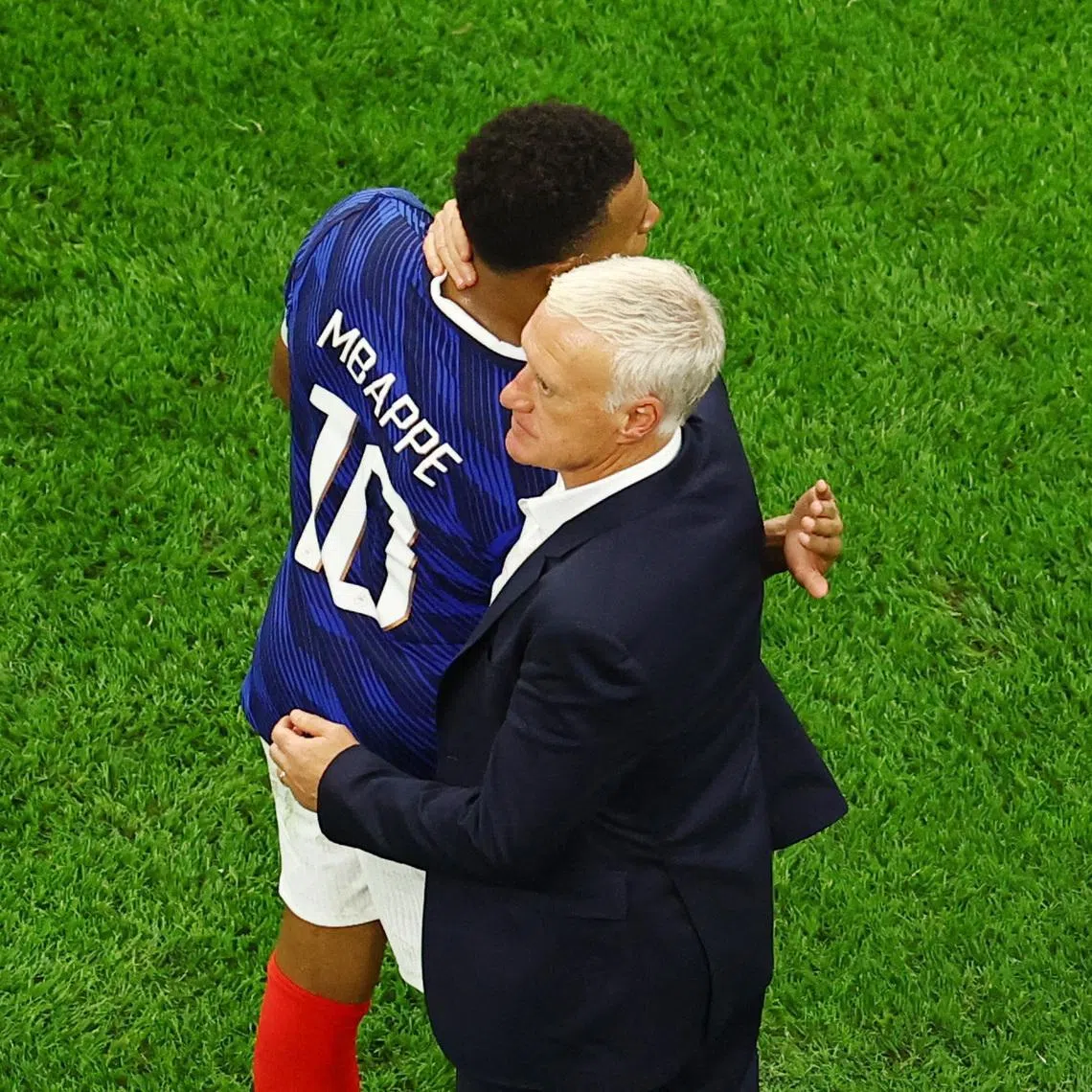 Soccer Football - FIFA World Cup 2026 - Semi Final - France v Spain - Dallas Stadium, Arlington, Texas, U.S. - July 14, 2026 France's Kylian Mbappe embraces coach Didier Deschamps after the match REUTERS/Marco Bello/File Photo
