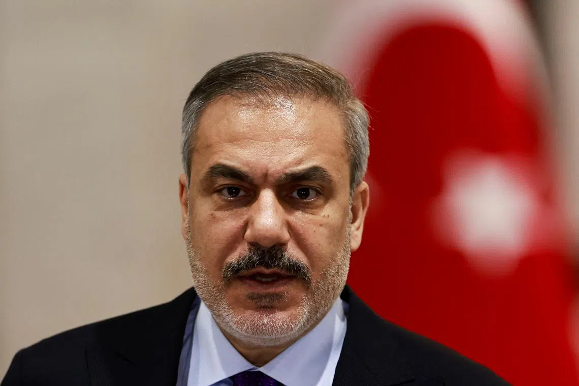 Turkish Foreign Minister Hakan Fidan attends a press conference with Iraqi Foreign Minister Fuad Hussein (not pictured), in Baghdad, Iraq January 26, 2025. REUTERS/Thaier Al-Sudani