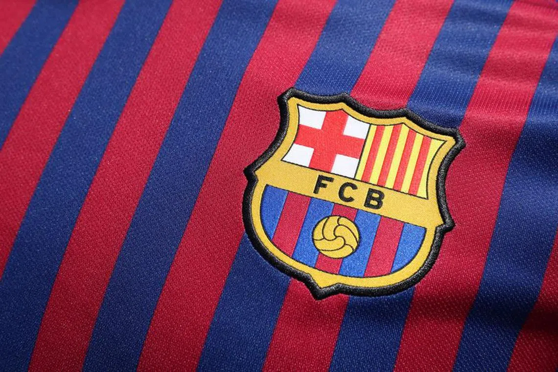 FILE PHOTO:Soccer Football - FC Barcelona unveil the new jersey for the season 2018-2019 - Barcelona, Spain - May 19, 2018   The new FC Barcelona jersey is unveiled   REUTERS/Albert Gea/File Photo