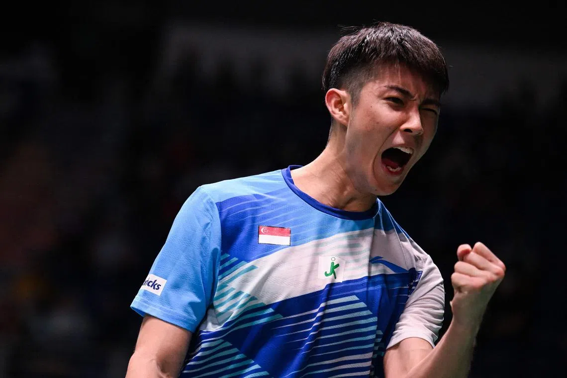 Singapore's Loh Kean Yew reacts after scoring a point against Thailand's Kunlavut Vitidsarn during their men’s singles quarter-finals match at the Malaysia Open badminton tournament in Kuala Lumpur on January 13, 2023. (Photo by Mohd RASFAN / AFP)