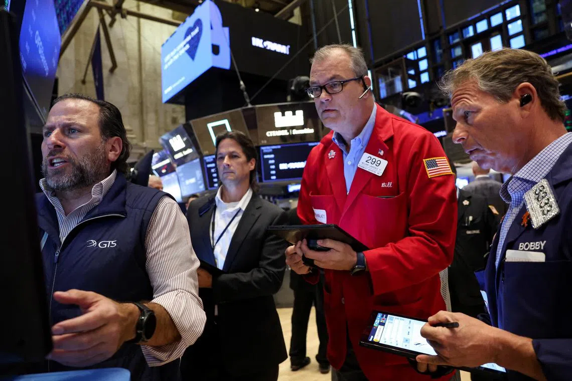 Traders working on the floor of the New York Stock Exchange, in New York City, on Oct 24.