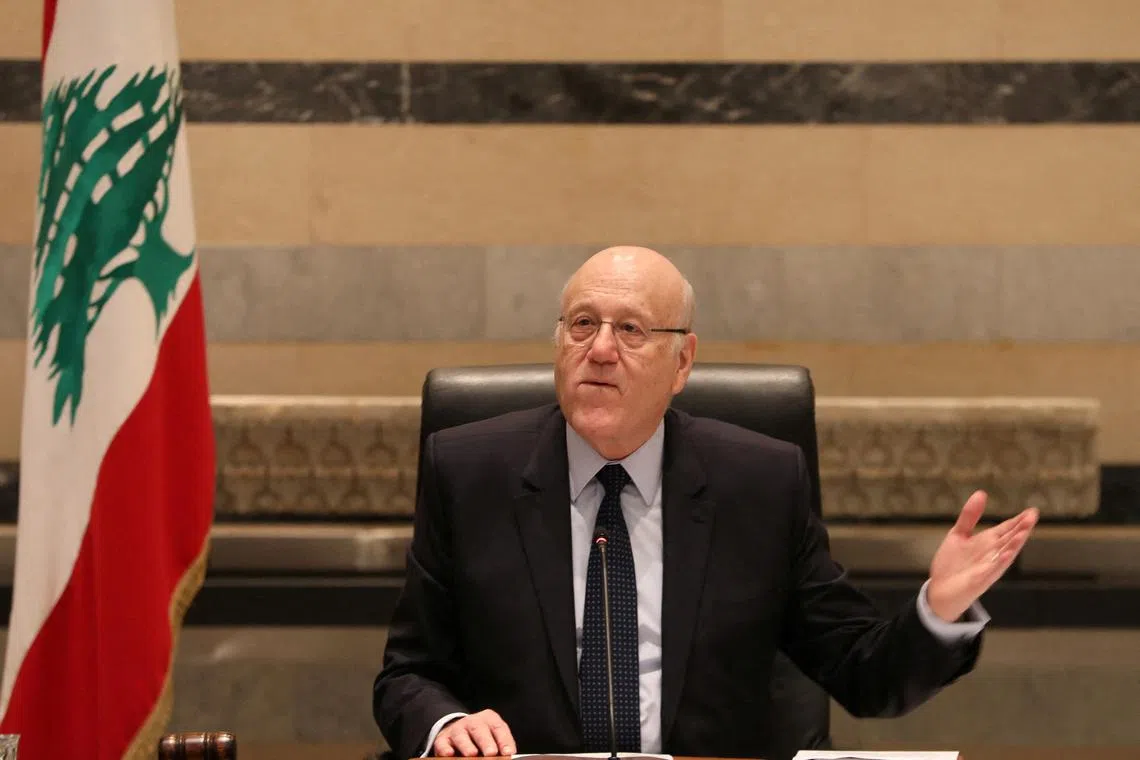 FILE PHOTO: Lebanon's caretaker Prime Minister Najib Mikati gestures as he heads a cabinet meeting at the government palace after a ceasefire between Israel and Hezbollah took effect, in Beirut, Lebanon November 27, 2024. Dalati Nohra/Handout via REUTERS/File Photo