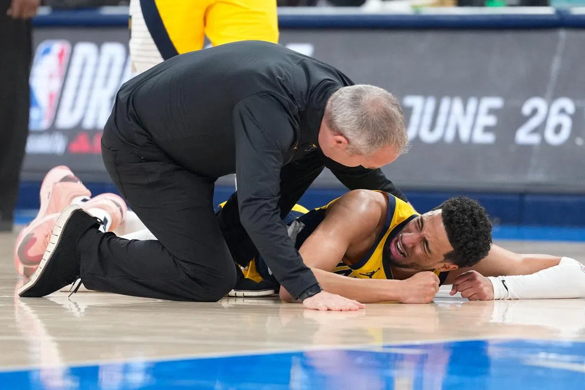 Jun 22, 2025; Oklahoma City, Oklahoma, USA; Indiana Pacers guard Tyrese Haliburton (0) reacts after suffering an injury during the first quarter against the Oklahoma City Thunder during game seven of the 2025 NBA Finals at Paycom Center. Mandatory Credit: Kyle Terada-Imagn Images