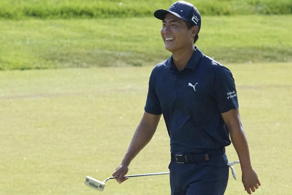 Tournament leader Justin Suh of the United States reacting as he walks the 18th green during the second round of the Memorial Tournament at Muirfield Village Golf Club on Friday 2023 in Dublin, Ohio. He fired a six-under 66 to stand at eight-under 136.