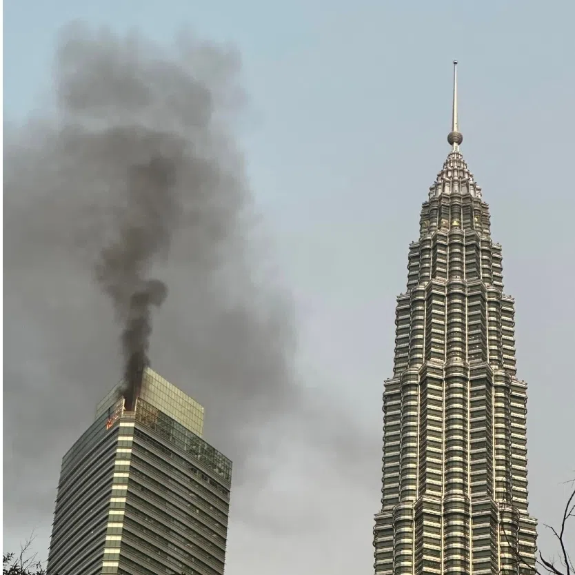Thick smoke seen billowing from the top of Petronas Tower 3 on the morning of Nov 1.
