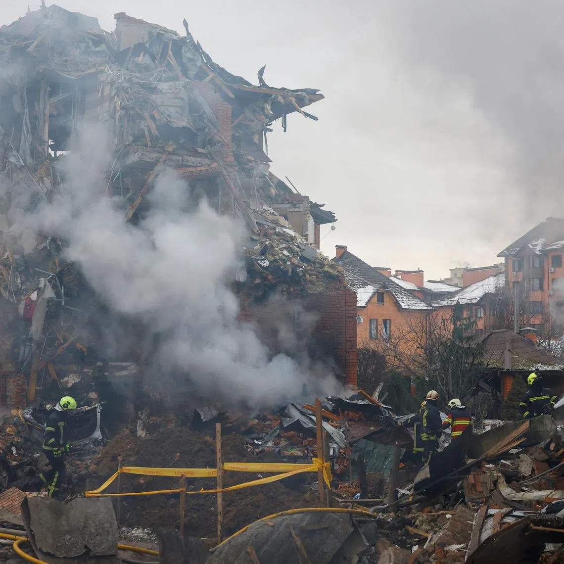 Firefighters work at the site of a residential building damaged during Russian drone and missile strikes, amid Russia's attack on Ukraine, in Kyiv, Ukraine, February 22, 2026. REUTERS/Valentyn Ogirenko