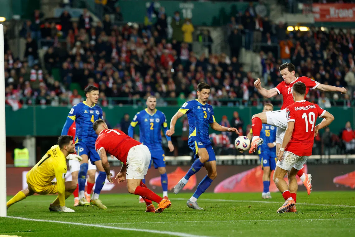 Soccer Football - FIFA World Cup - UEFA Qualifiers - Group H - Austria v Bosnia and Herzegovina - Ernst-Happel-Stadion, Vienna, Austria - November 18, 2025 Austria's Michael Gregoritsch scores their first goal REUTERS/Lisa Leutner