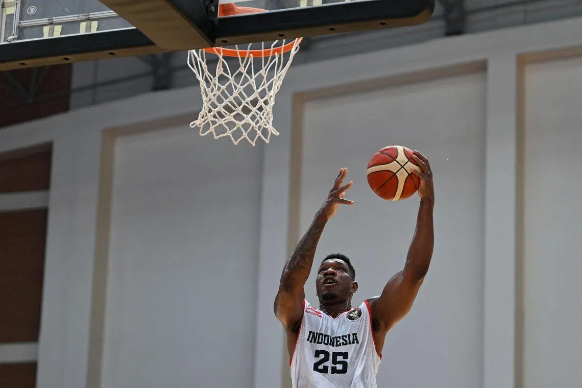 Indonesia's Lester Prosper goes for the basket during the match against Laos at the SEA Games.