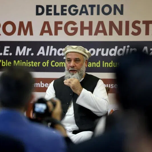 Afghanistan's Taliban Trade Minister Nooruddin Azizi addresses a delegation during a meeting in New Delhi, India, on Nov 21, 2025.