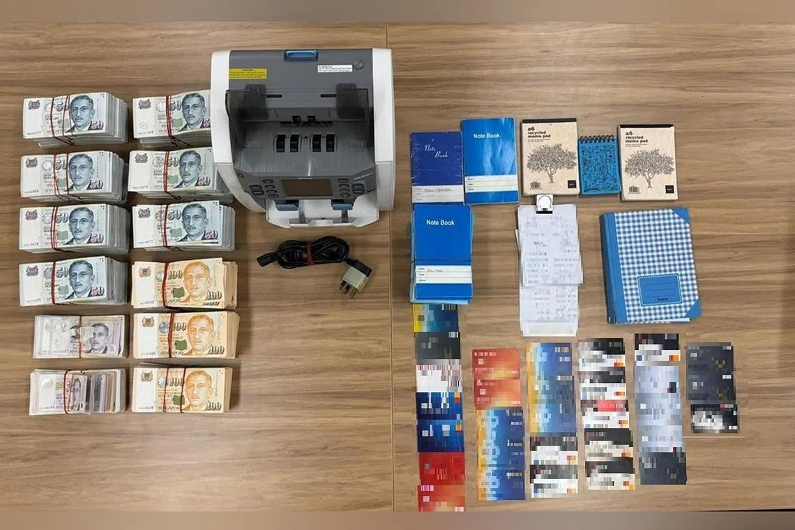 More than $314,000 in cash and 30 ATM cards were seized, among other items, during a raid of the operations.