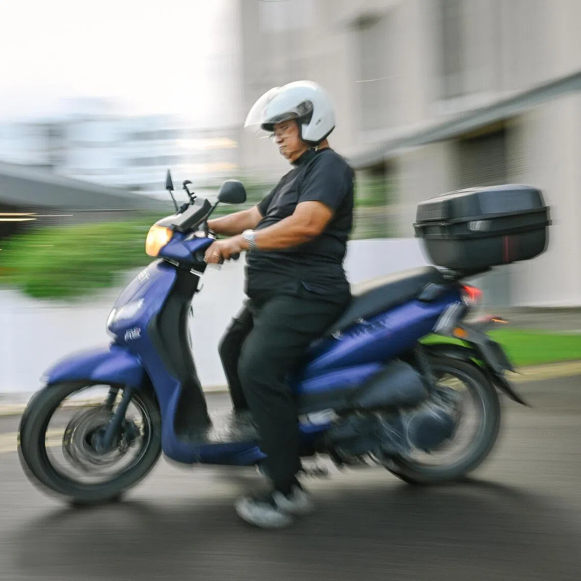 Anthony Png, 80, on his scooter at Temasek Polytechnic, where he is pursuing his second diploma.