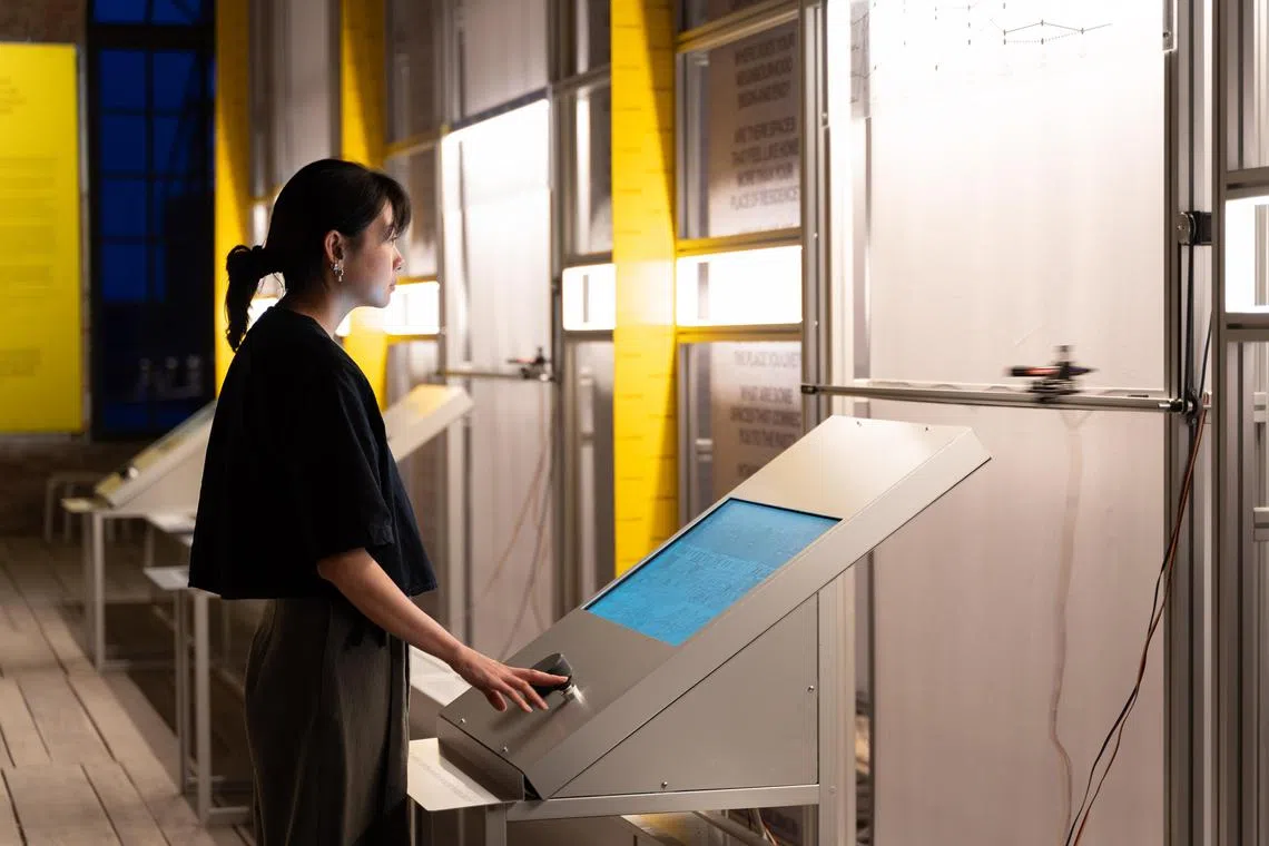 The centrepiece of the Singapore Pavilion is a Values Measurement Machine, a series of analogue plotting machines that mark data on rotating calligraphic scrolls.