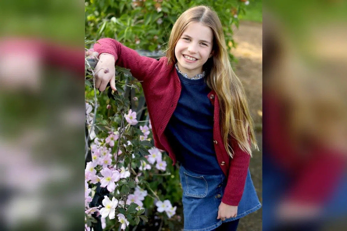 The Princess of Wales, Charlotte, is pictured smiling happily in the garden of their home in Windsor.