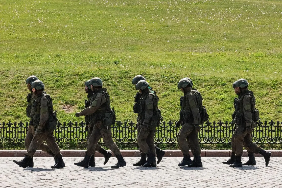 Russian army servicemen walk at an exhibition displaying armoured vehicles and equipment captured by the Russian army from Ukrainian forces in the course of Russia-Ukraine conflict, at Victory Park open-air museum on Poklonnaya Gora in Moscow, Russia May 31, 2024.  REUTERS/Shamil Zhumatov