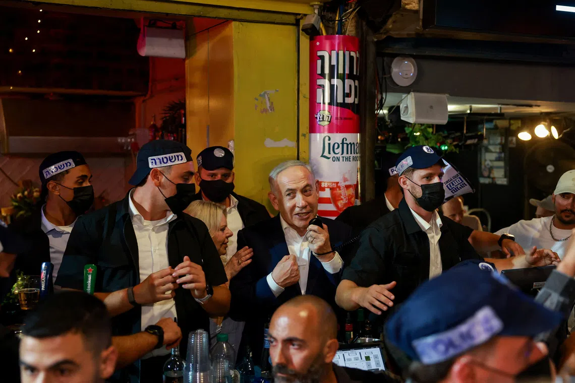 Israeli Prime Minister Benjamin Netanyahu, leader of the Likud party, speaks as he tours Mahane Yehuda market, ahead of Israel's national election, in Jerusalem, October 23, 2026. REUTERS/Ronen Zvulun
