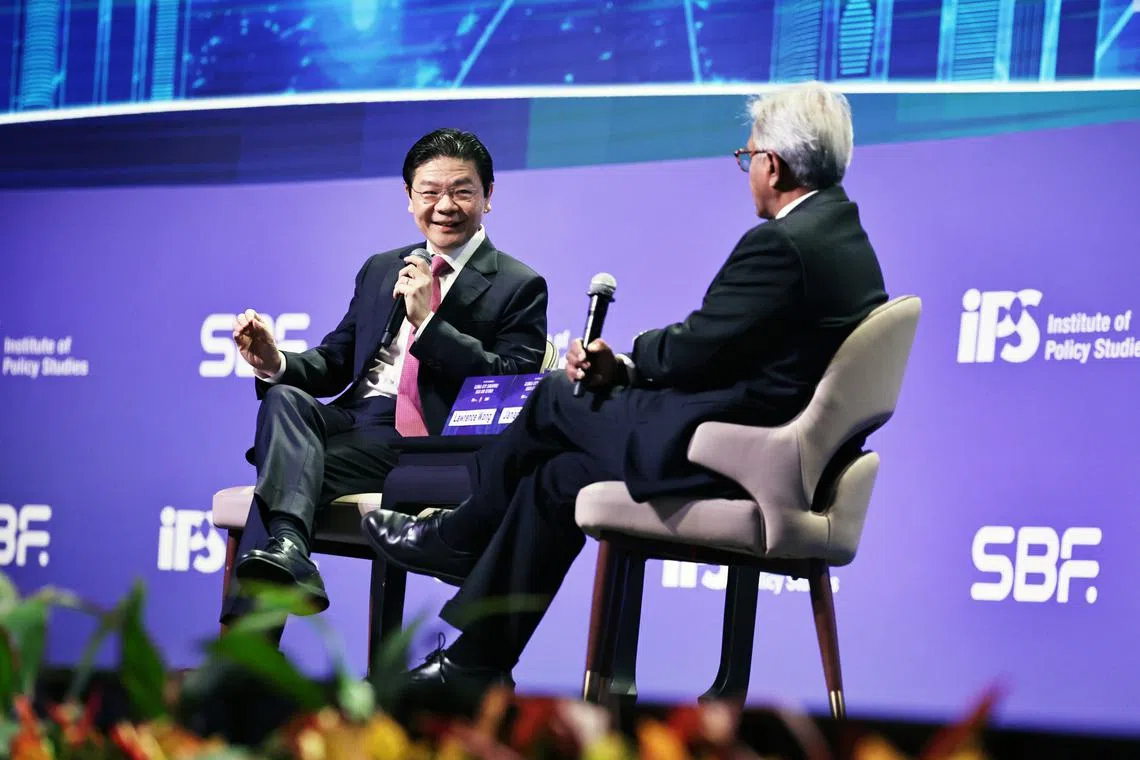 Prime Minister Lawrence Wong speaks during a dialogue moderated by IPS director Janadas Devan on July 29.