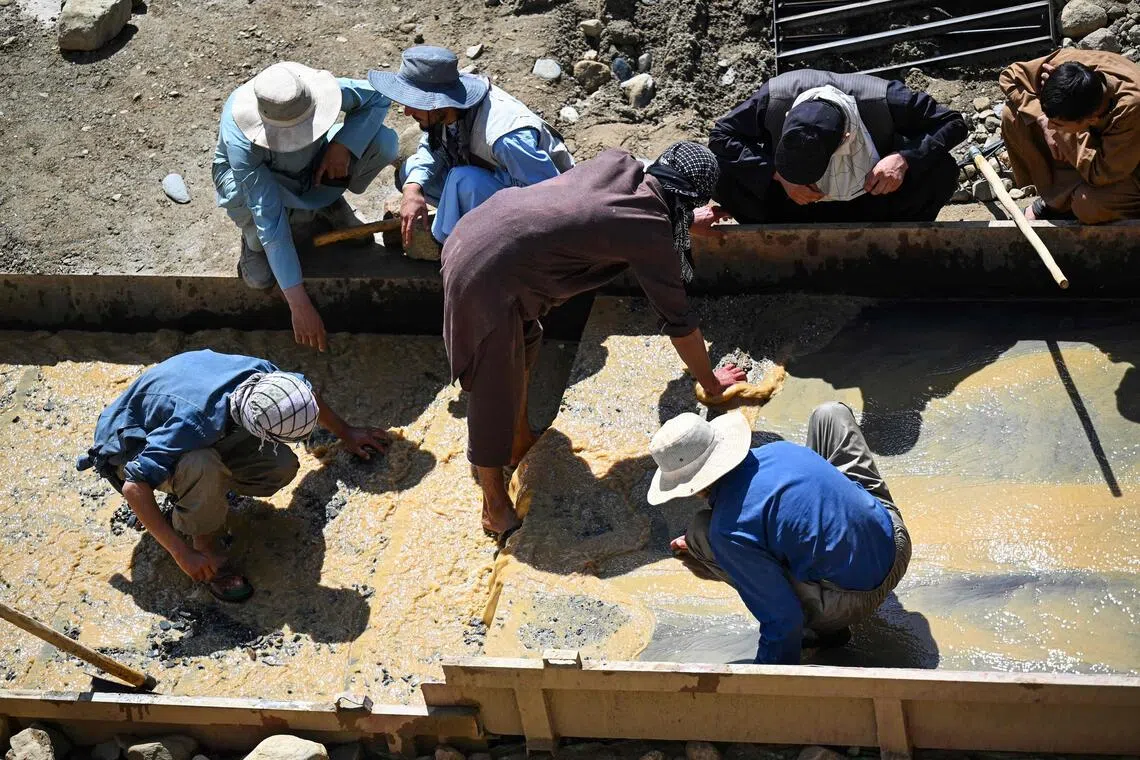 Afghan miners separating dirt and stones from gold nuggets at Gulak-Dara valley in Shiwa area of Afghanistan’s north-eastern Badakhshan province.