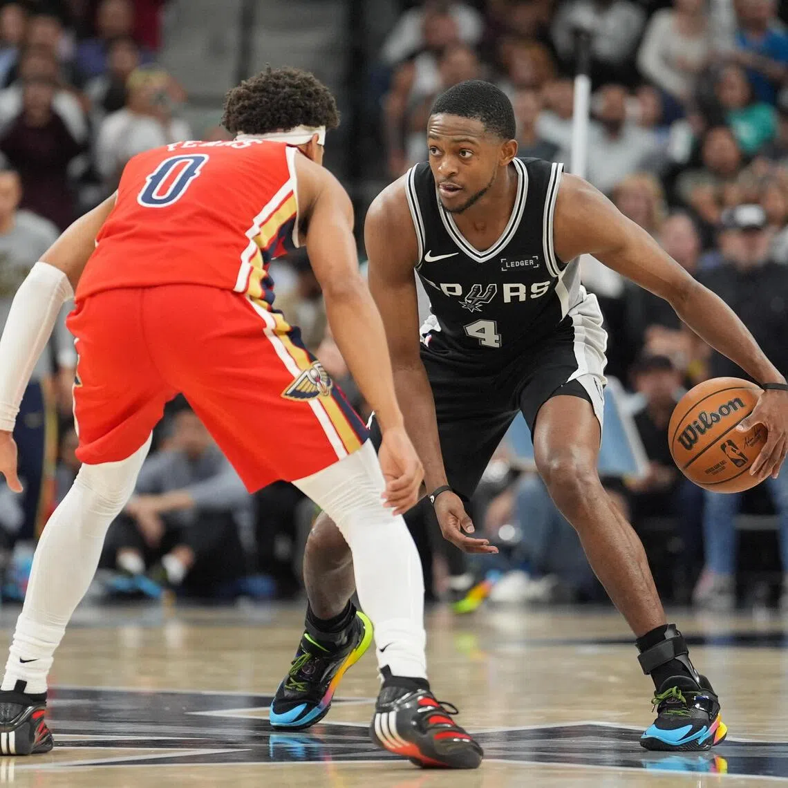 San Antonio Spurs guard De'Aaron Fox dribbling against New Orleans Pelicans guard Jeremiah Fears in the second half of the Spurs' 126-119 NBA win at Frost Bank Centre.