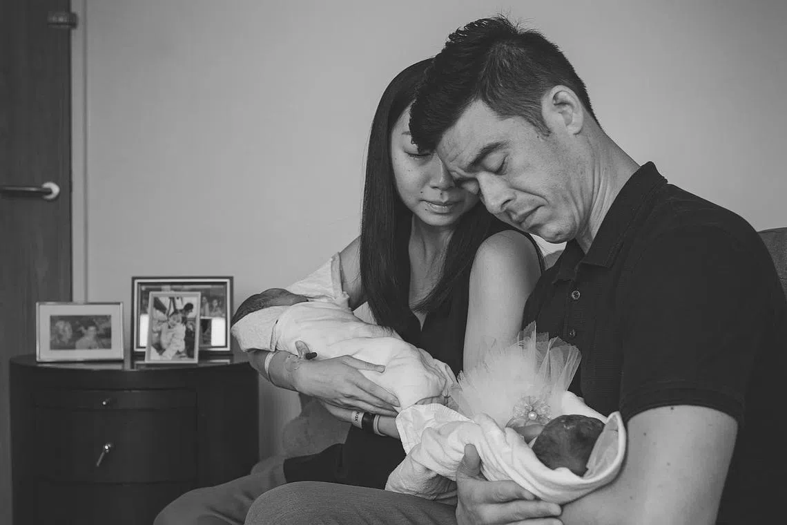 Ms Mandy Too and her husband Aidan Hoy with their twins Abigail and Lara who were stillborn.