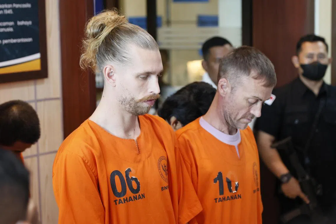 epa12363669 Two British nationals, identified with the initials KG and PE, are escorted during a press conference at the Bali’s National Narcotics Agency office in Denpasar, Bali, Indonesia, 09 September 2025. KG and PE were arrested over alleged drug smuggling.  EPA/MADE NAGI