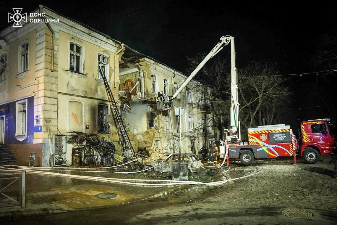 Rescuers work at the site of an apartment building hit by a Russian drone strike, amid Russia's attack on Ukraine, in Odesa, Ukraine in this handout picture released March 19, 2026. Press service of the State Emergency Service of Ukraine in Odesa region/Handout via REUTERS