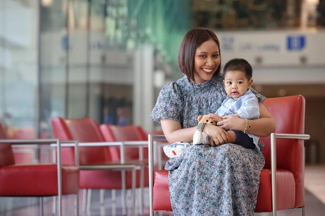 Lupus patient Nur Amalina Norraimi with her son, Shayaan Aniq Syaifulbahari, who was born in January 2024. She worried whether her condition would allow her to start a family. ST PHOTO: JASON QUAH