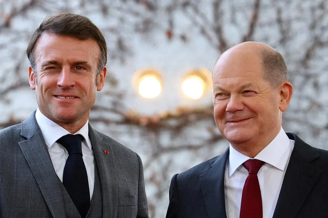 FILE PHOTO: German Chancellor Olaf Scholz poses with French President Emmanuel Macron, during the \"Compact with Africa\" investment summit, at the Chancellery in Berlin, Germany, November 20, 2023. REUTERS/Fabrizio Bensch/File Photo