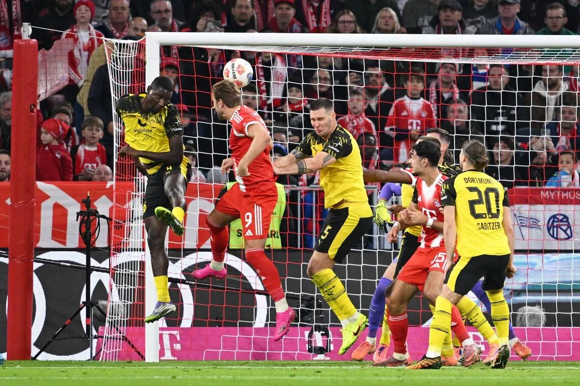Bayern Munich's Harry Kane scoring their first goal in the 2-1 win over Borussia Dortmund on Oct 18.