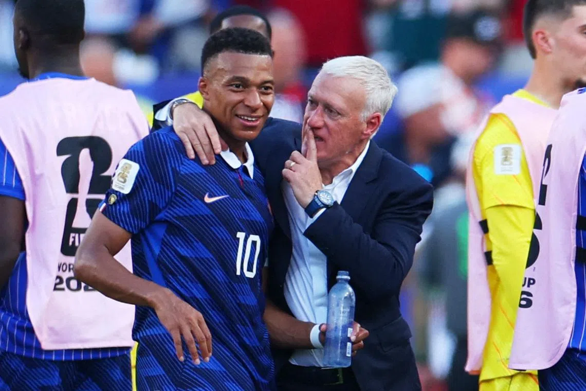 Soccer Football - FIFA World Cup 2026 - Round of 16 - Paraguay v France - Philadelphia Stadium, Philadelphia, Pennsylvania, U.S. - July 4, 2026  France coach Didier Deschamps and France's Kylian Mbappe celebrate after the match as France qualify for the quarter final stage of the World Cup REUTERS/Mike Segar