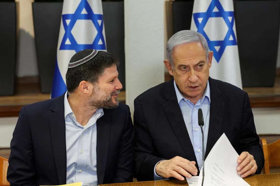 Israeli Finance Minister Bezalel Smotrich (left) and Israeli Prime Minister Benjamin Netanyahu at a Cabinet meeting in January 2024.