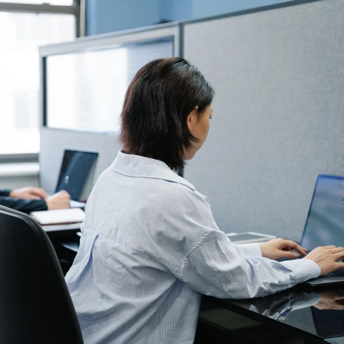 AI enables us to work faster but productivity gains do not automatically become free time, says the writer.