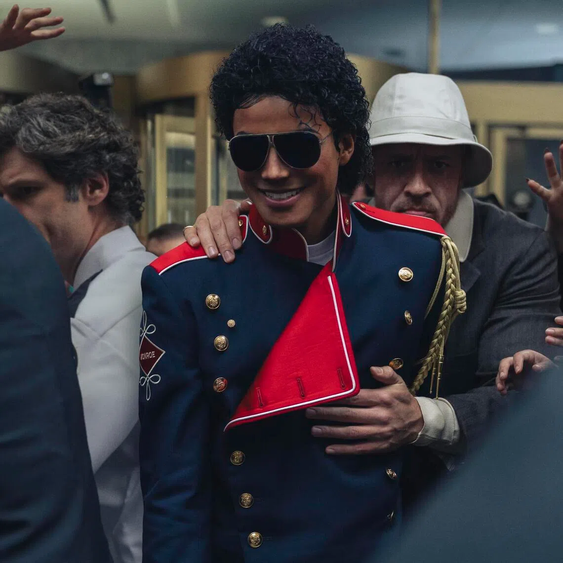 Jaafar Jackson (middle) as Michael Jackson and KeiLyn Durrel Jones (behind) as Jackson's bodyguard Bill Bray in Michael.