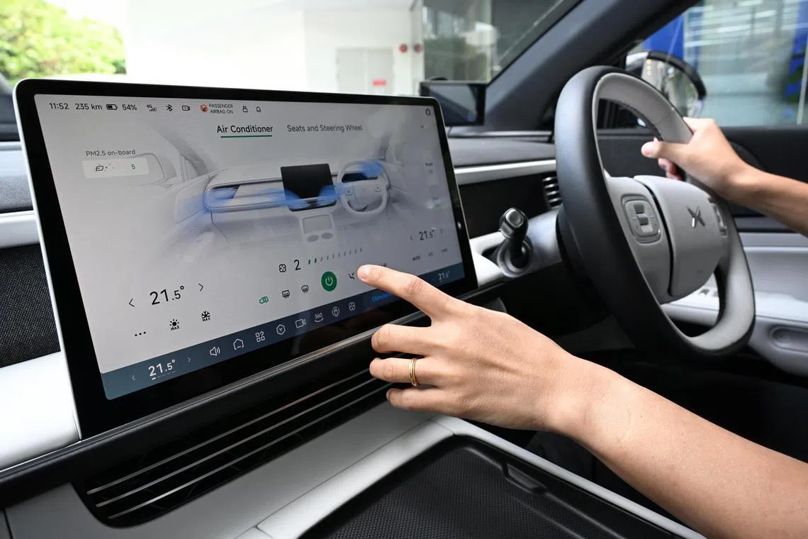 Generic photo of a driver adjusting the airconditioning in the electric car Xpeng G6 taken on Feb 10, 2025.