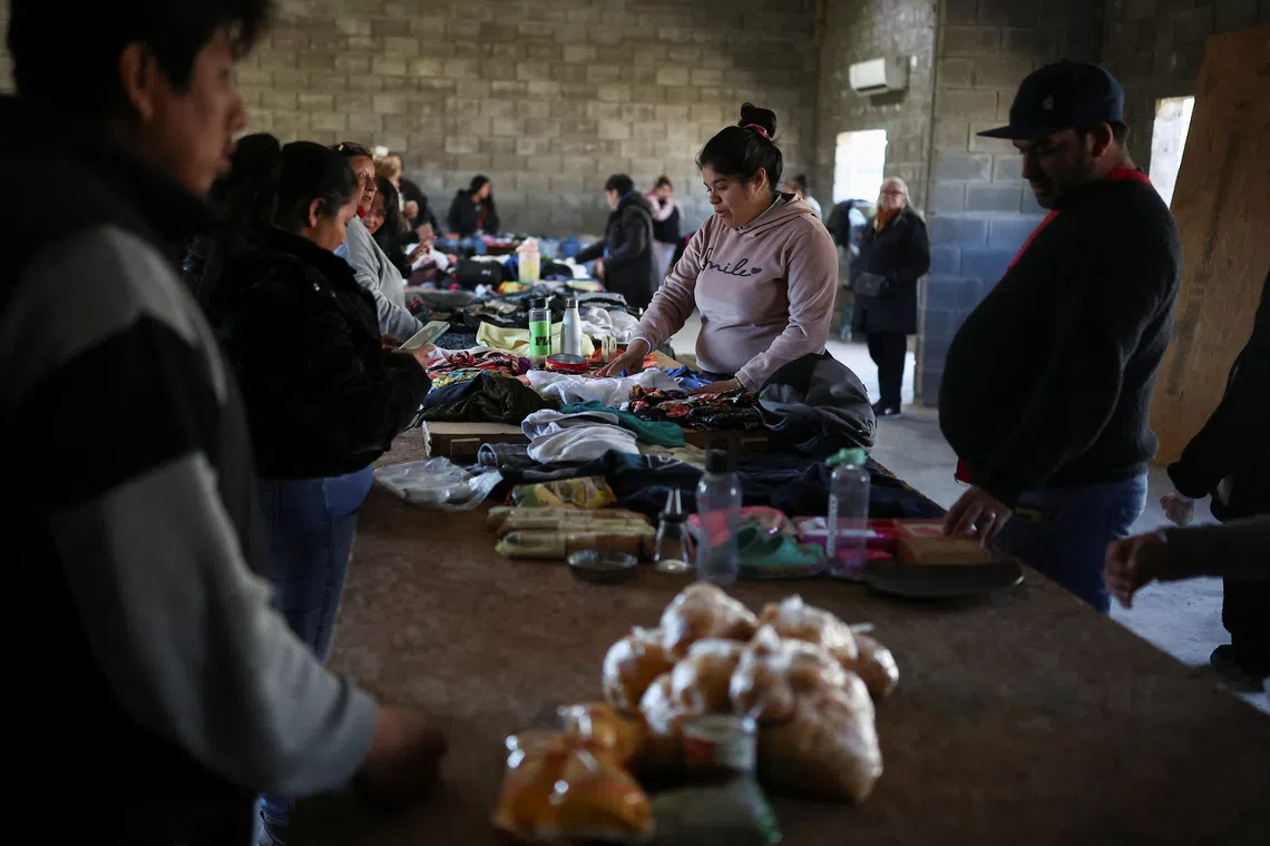 People barter goods, as soup kitchens, barter clubs and families taking out short-term loans for groceries are exposing the social strains emerging under Argentine President Javier Milei's austerity program, barely a year before Argentina's next presidential election, in Lomas de Zamora, on the outskirts of Buenos Aires, Argentina, September 13, 2026. REUTERS/Agustin Marcarian