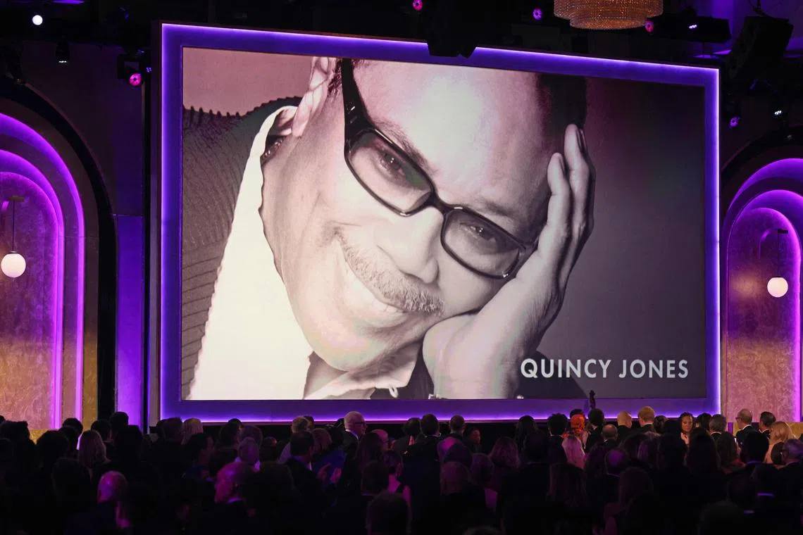 Late US record producer Quincy Jones appears on screen as he receives and honorary award during the Academy of Motion Picture Arts and Sciences' 15th Annual Governors Awards at the Ray Dolby Ballroom in Los Angeles on Nov 17.