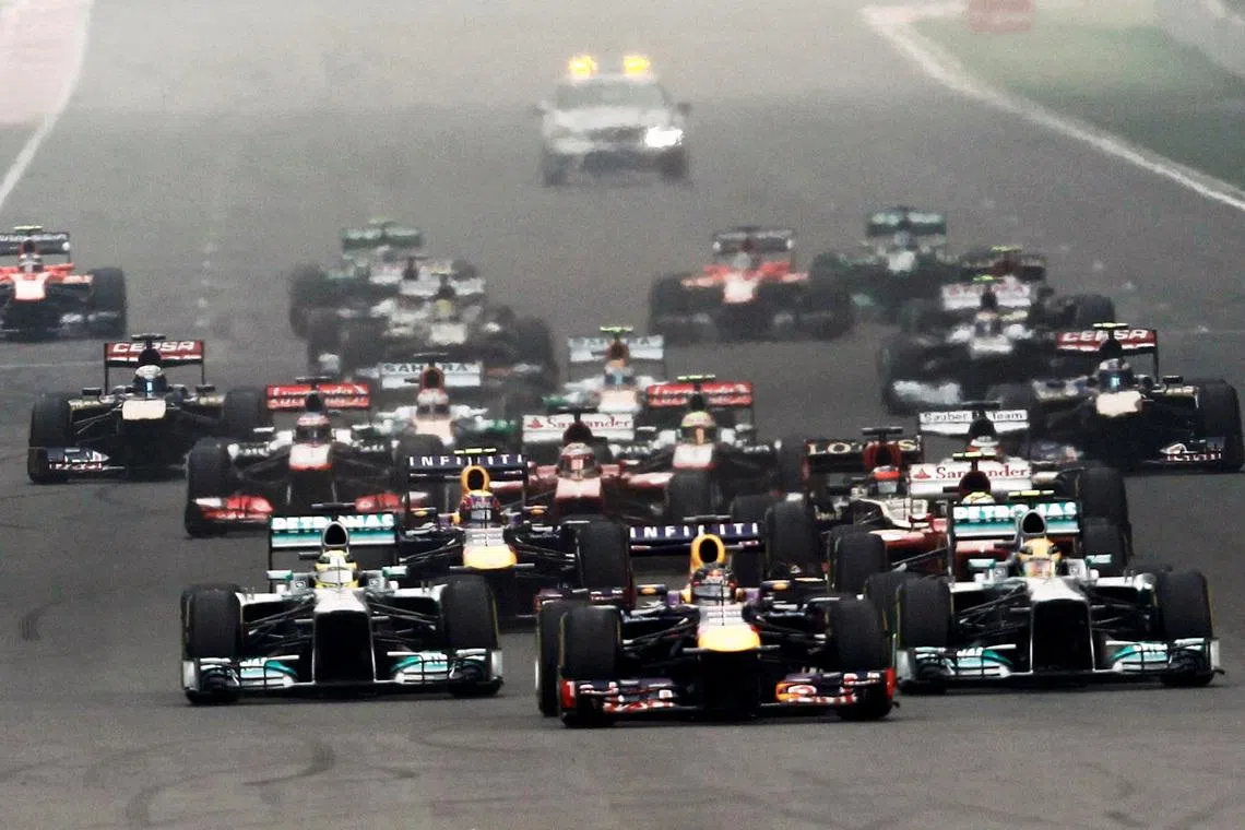 FILE PHOTO: Red Bull Formula One driver Sebastian Vettel of Germany leads the field at the start of the Indian F1 Grand Prix at the Buddh International Circuit in Greater Noida, on the outskirts of New Delhi,  October 27, 2013. REUTERS/Adnan Abidi /File Photo