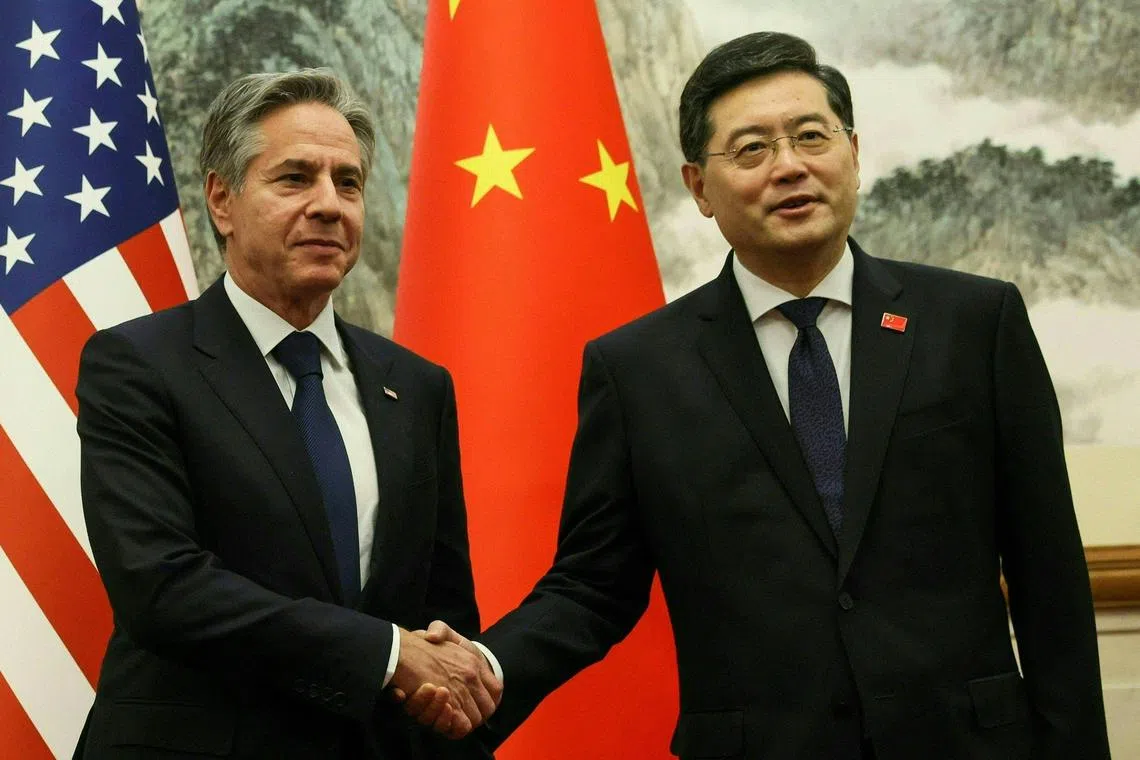 US Secretary of State Antony Blinken and China's Foreign Minister Qin Gang shaking hands ahead of a meeting at the Diaoyutai State Guesthouse in Beijing on June 18, 2023.