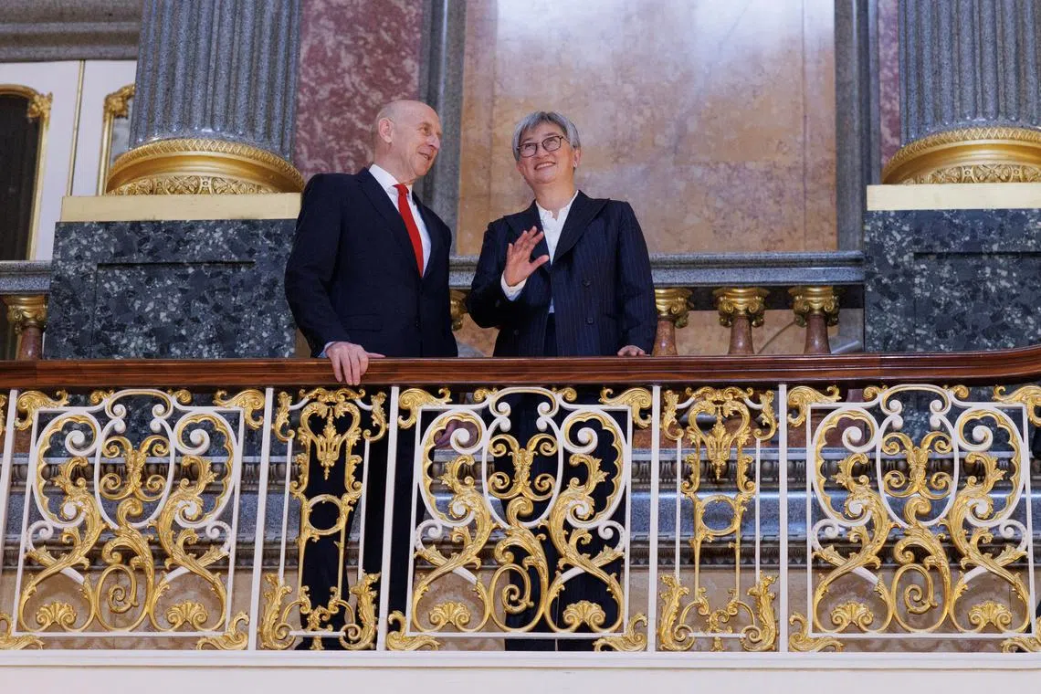 FILE PHOTO: British Defence Secretary John Healey stands with the Australian Minister for Foreign Affairs Penny Wong at Lancaster House ahead of the annual Australia-UK Ministerial Consultations (AUKMIN) meeting on December 16, 2024 in London, Britain. Dan Kitwood/Pool via REUTERS/File Photo