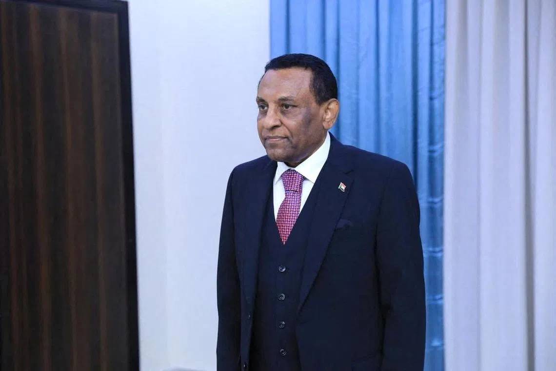 FILE PHOTO: Former UN official Kamil Idris is sworn in, as Sudan's new prime minister in front of Sudan army chief, Abdel Fattah al-Burhan (not pictured) in Port Sudan, Sudan, May 31, 2025. Sudan Transitional Sovereignty Council/Handout via REUTERS/File Photo