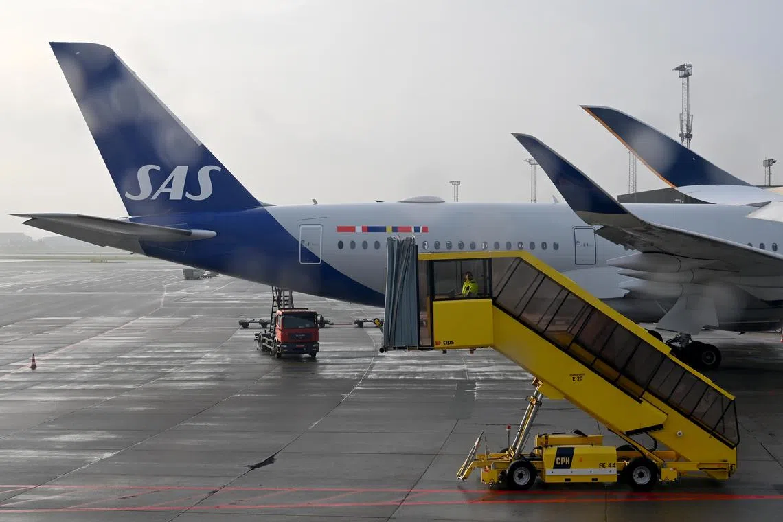 ST20211026-202117088182-Lim Yaohui-pixgeneric/
Scandinavian Airlines, more commonly known as SAS, is the flag carrier of Denmark, Norway, and Sweden. This plane is parked at Copenhagen Airport in Denmark on Oct 26, 2021.
(ST PHOTO: LIM YAOHUI)