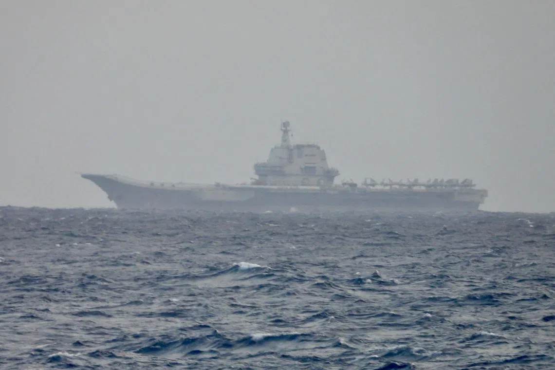 A handout photo taken on March 31 shows Chinese aircraft carrier Shandong sailing in waters off Taiwan.
