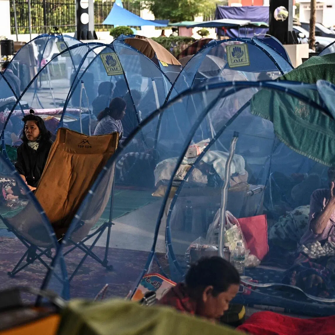 People displaced by renewed clashes between Thailand and Cambodia take shelter at an evacuation centre in Thailand’s Sa Kaeo province.