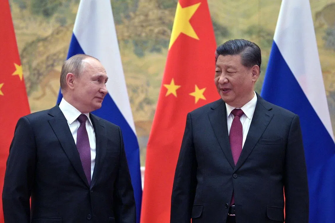 Russian President Vladimir Putin (left) and Chinese President Xi Jinping posing for a photograph during their meeting in Beijing in 2022. 