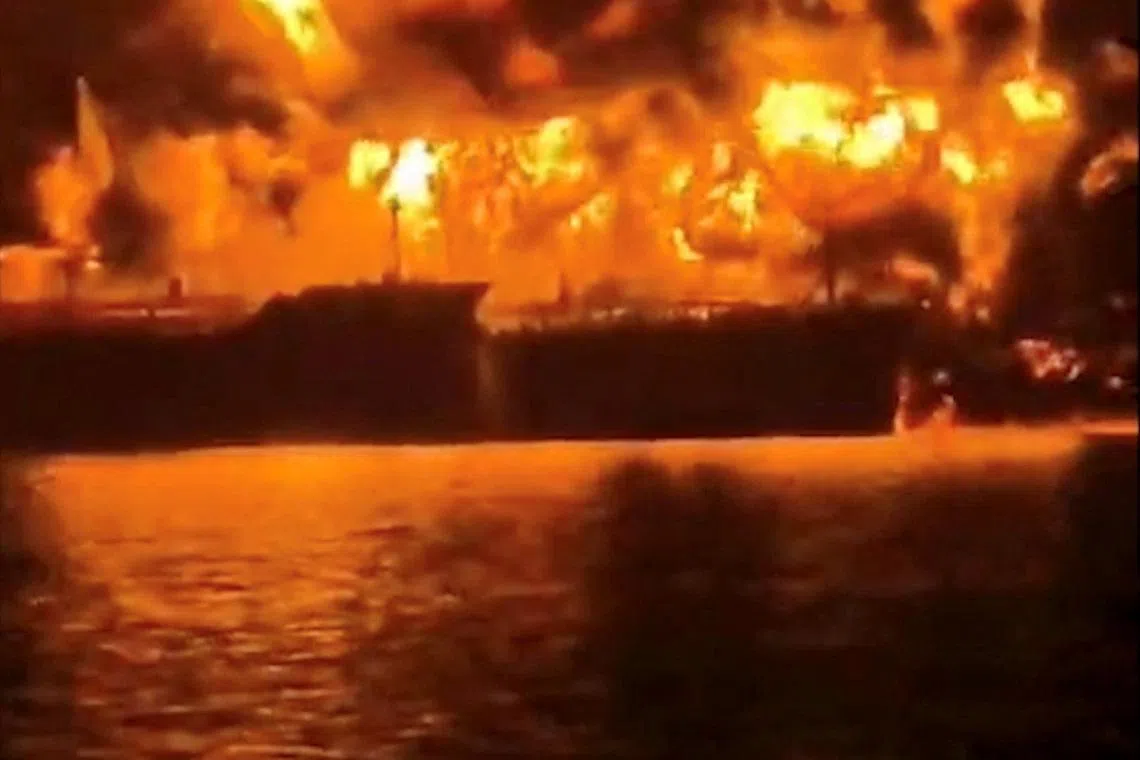 A ship burns, after Iranian explosive-laden boats appear to have attacked two fuel tankers in Iraqi waters setting them ablaze, according to port, maritime security and risk firms, amid the U.S.-Israeli conflict with Iran, in this screengrab taken from a handout video released March 12, 2026.     Media Office of Iraqi Ports/Handout via REUTERS