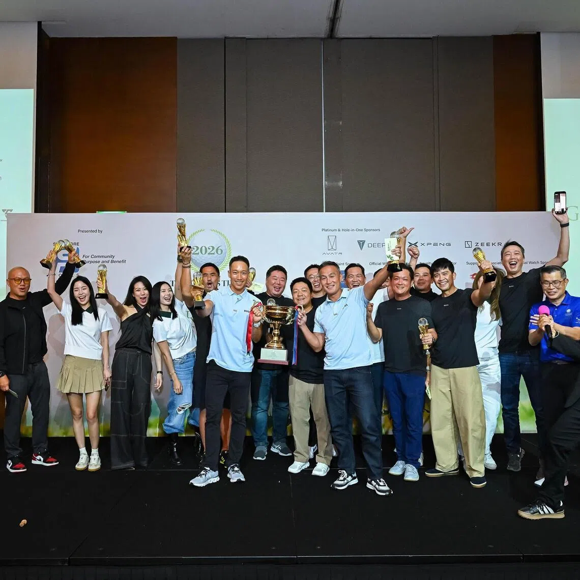 The Hugo Boss team, with captain Andre Huber (middle) holding the trophy, celebrating their victory in The Straits Times & Business Times Corporate Golf League at the Singapore Island Country Club on May 8.