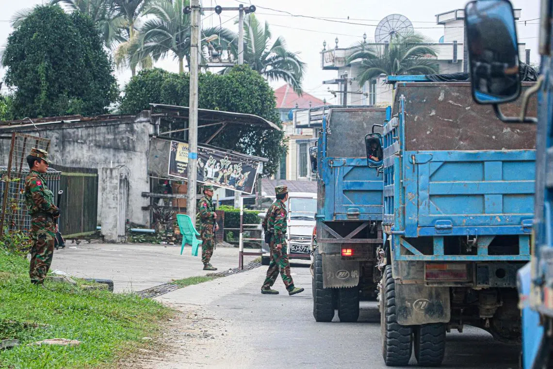 Fighters of the ethnic rebel group Ta'ang National Liberation Army standing guard in Myanmar’s Shan state on Nov 10, 2023.