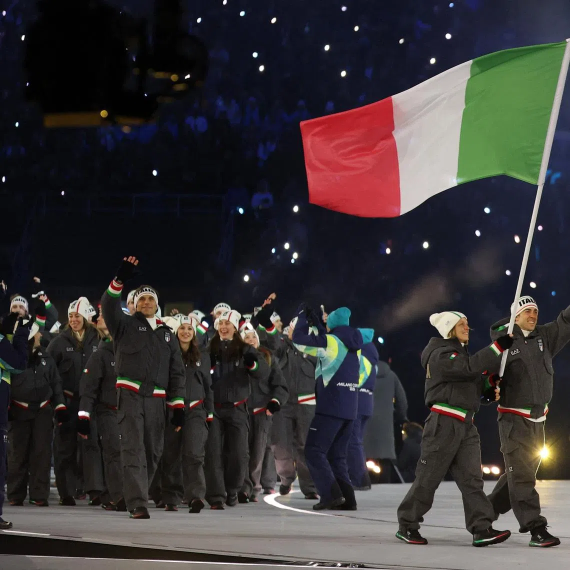 Milano Cortina 2026 Olympics - Opening Ceremony - San Siro Stadium, Milan, Italy - February 06, 2026. Flagbearers Arianna Fontina of Italy and Federico Pellegrino of Italy in the athletes parade during the opening ceremony REUTERS/Yara Nardi