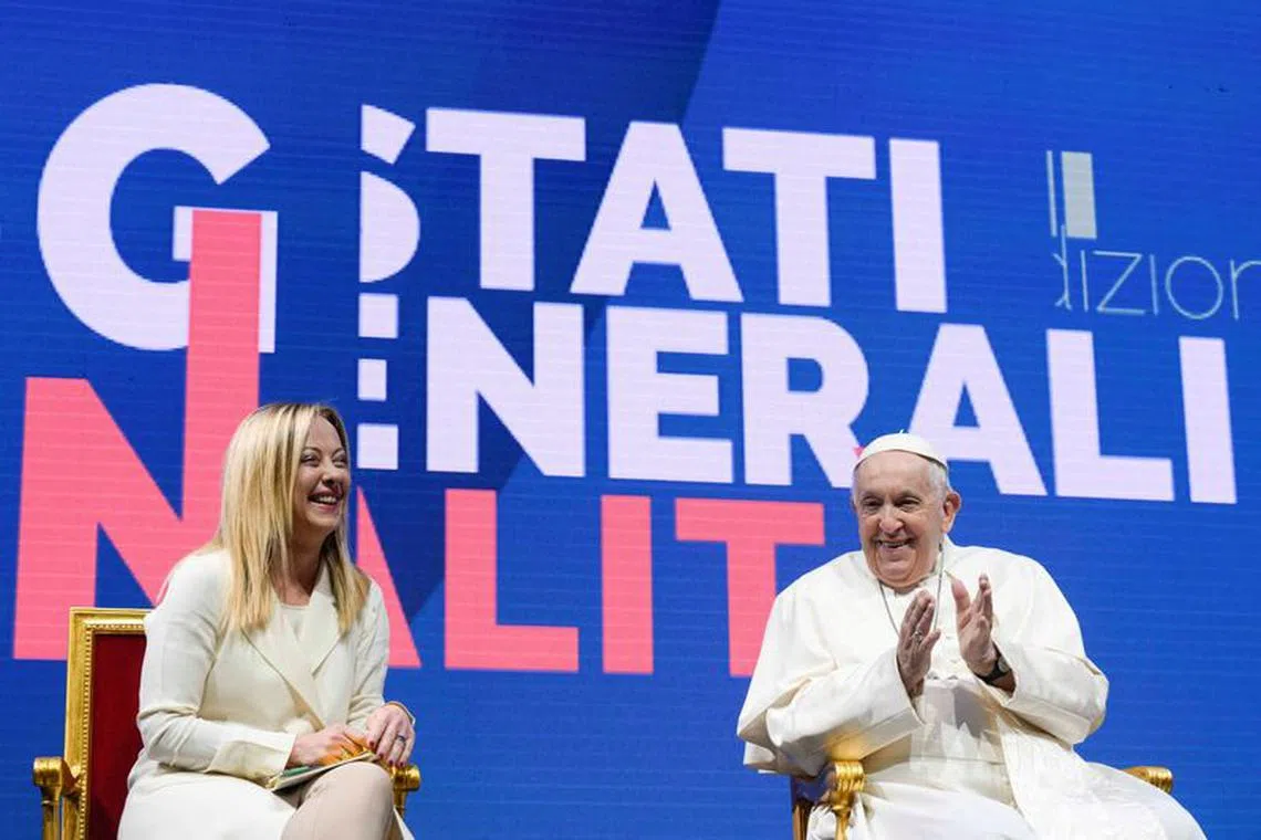 FILE PHOTO: Pope Francis and Italy's Prime Minister Giorgia Meloni attend a national confront on demographics in Rome, Italy, May 12, 2023. Vatican Media/­Handout via REUTERS/File Photo