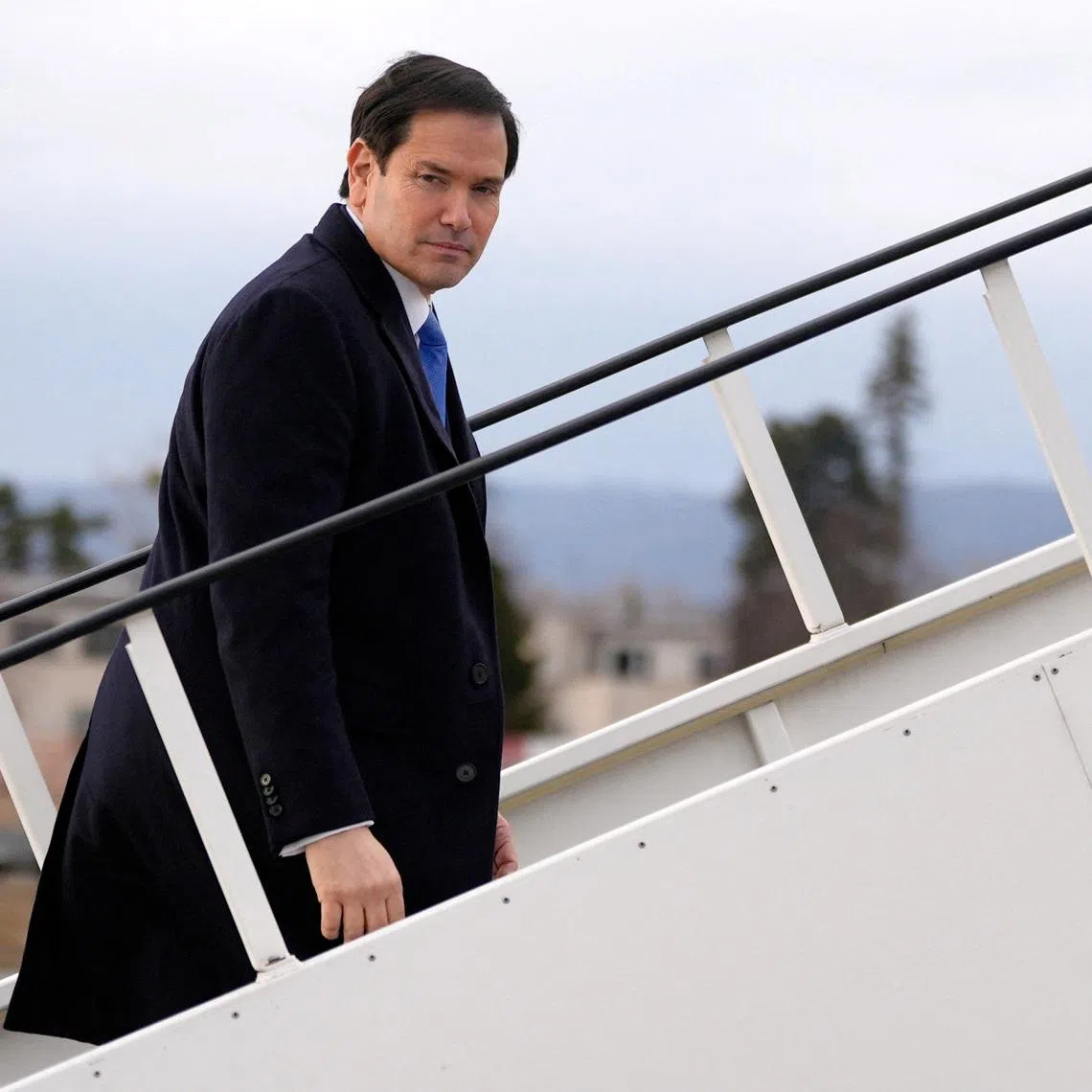 U.S. Secretary of State Marco Rubio boards a plane while departing Bratislava Airport in Bratislava, Slovakia, Sunday, Feb. 15, 2026.     Alex Brandon/Pool via REUTERS