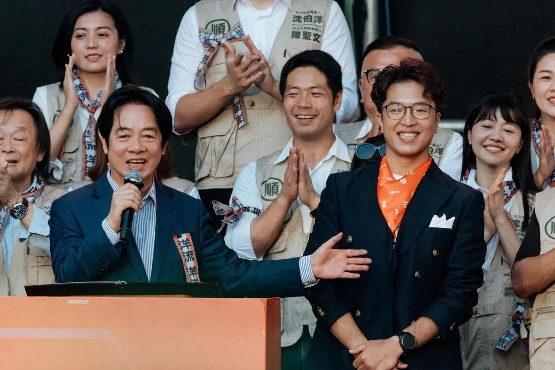 Taiwan President Lai Ching-te (left) delivering a speech in support of Democratic Progressive Party (DPP) Taipei mayoral candidate Puma Shen (right) during the opening of Shen’s campaign headquarters in Taipei on Oct 4.
